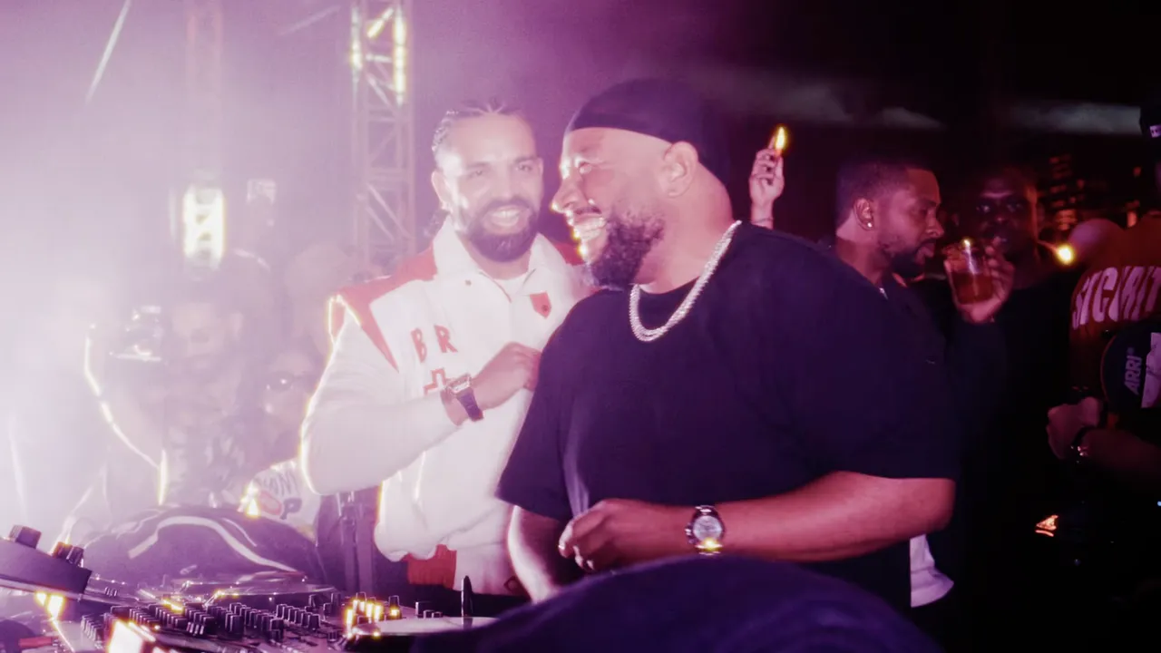 Drake and Gordo laughing at the DJ booth at Taraka, Toronto
